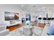 Open-concept living space showcasing hardwood floors, contemporary furnishings, and an airy atmosphere at 5730 Imperial Ky, Tampa, FL 33615