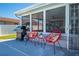 Cozy outdoor area with grill and seating next to backyard putting green at 5730 Imperial Ky, Tampa, FL 33615