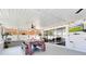 Enclosed patio boasts plenty of natural light with tile flooring and a dining table set for a relaxing meal at 5730 Imperial Ky, Tampa, FL 33615