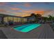 Beautiful backyard with a sparkling pool, a well-maintained deck, and lush landscaping at 5730 Imperial Ky, Tampa, FL 33615