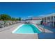 Inviting pool area with lounge chairs and summer kitchen at 5730 Imperial Ky, Tampa, FL 33615
