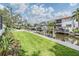 Beautiful backyard featuring a canal, dock, and lush landscaping, great for waterfront living at 650 Geneva Pl, Tampa, FL 33606