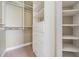 Organized walk-in closet with ample shelving and hanging space for optimal storage at 650 Geneva Pl, Tampa, FL 33606