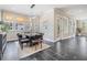 Elegant dining room with gray chairs, a wood table, and large windows at 650 Geneva Pl, Tampa, FL 33606