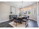Comfortable dining room featuring modern lighting, stylish gray chairs, and window views at 650 Geneva Pl, Tampa, FL 33606