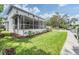 Spacious screened patio with a view of landscaped yard and canal-front access at 650 Geneva Pl, Tampa, FL 33606