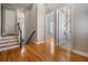 Bright hallway with hardwood floors, connecting to a bedroom and bathroom at 650 Geneva Pl, Tampa, FL 33606