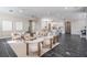 Spacious living room with modern furniture, natural light, and an open layout leading into the kitchen at 650 Geneva Pl, Tampa, FL 33606