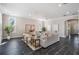 Bright living room featuring neutral decor and a decorative accent plant at 650 Geneva Pl, Tampa, FL 33606