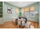 Home office with hardwood floors, natural light, and comfortable seating at 650 Geneva Pl, Tampa, FL 33606