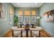 Home office with hardwood floors, natural light, and comfortable seating at 650 Geneva Pl, Tampa, FL 33606