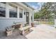 Outdoor patio featuring a unique tile table and seating area at 650 Geneva Pl, Tampa, FL 33606