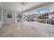 Open-air screened patio offering scenic backyard and waterfront views at 650 Geneva Pl, Tampa, FL 33606