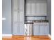Wet bar area featuring granite countertops, cabinets and stainless steel under-counter refrigerator at 650 Geneva Pl, Tampa, FL 33606