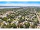 Wide aerial shot shows the property and neighborhood in proximity to waterfront area at 716 35Th W St, Bradenton, FL 34205