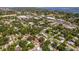 Aerial view highlighting the property's location in a residential neighborhood, near commercial area at 716 35Th W St, Bradenton, FL 34205