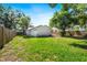 Expansive backyard featuring lush green grass, enclosed by a wooden fence for privacy at 716 35Th W St, Bradenton, FL 34205