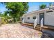Charming home featuring a wooden deck and brick-paved patio, perfect for outdoor entertaining at 716 35Th W St, Bradenton, FL 34205