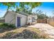 Cozy backyard offering a brick-paved patio and additional storage space with a shed at 716 35Th W St, Bradenton, FL 34205