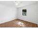 Clean, bright bedroom with hardwood floors and large window at 716 35Th W St, Bradenton, FL 34205
