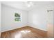 Bright, clean bedroom with hardwood floors and a large window at 716 35Th W St, Bradenton, FL 34205