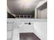 This space features high ceilings, a ceiling fan, and stairs to an upper loft area at 716 35Th W St, Bradenton, FL 34205