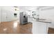 Open concept floor plan featuring a kitchen with stainless appliances and granite countertops at 716 35Th W St, Bradenton, FL 34205