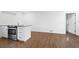 View of the modern kitchen with stainless appliances and breakfast bar at 716 35Th W St, Bradenton, FL 34205