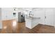 Modern kitchen with stainless appliances, white cabinetry, and a stylish island for extra counter space at 716 35Th W St, Bradenton, FL 34205