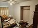 Cluttered bedroom featuring old furniture, and personal items strewn about the room at 8109 Franklin Rd, Plant City, FL 33565