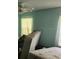 Bedroom filled with lots of clutter and an old mattress and boxspring, in need of cleaning at 8109 Franklin Rd, Plant City, FL 33565