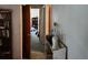 Hallway and open door, needing cleaning and repair; has shelf for decoration at 8109 Franklin Rd, Plant City, FL 33565