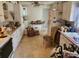 A dated kitchen with cabinets, appliances, and breakfast table needing renovation and decor at 8109 Franklin Rd, Plant City, FL 33565