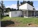Spacious backyard featuring a screened lanai, ideal for outdoor relaxation and entertainment at 8274 Rose Ter, Seminole, FL 33777