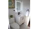Updated bathroom featuring a vanity with matte black accents, stylish lighting, and tile floors at 8274 Rose Ter, Seminole, FL 33777