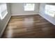 Bright bedroom with two large windows and sleek floors at 8274 Rose Ter, Seminole, FL 33777