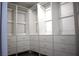 A spacious walk-in closet features custom shelving and ample storage for an organized wardrobe at 8274 Rose Ter, Seminole, FL 33777