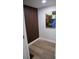 An architectural wood paneling accents the entrance hallway, and is brightly lit with modern wood flooring at 8274 Rose Ter, Seminole, FL 33777