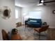 Stylish living room featuring modern furniture, a ceiling fan, hardwood floors, and ample natural light at 8274 Rose Ter, Seminole, FL 33777