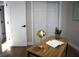 Cozy office space featuring a modern desk, stylish decor, and a convenient location near the bedroom and closets at 8274 Rose Ter, Seminole, FL 33777