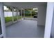 A screened-in porch offers a delightful space for outdoor relaxation with ample room for seating at 8274 Rose Ter, Seminole, FL 33777