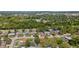 Aerial view of property showing location within a mature residential neighborhood at 945 Winding Oaks Dr, Palm Harbor, FL 34683