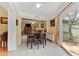 Dining area featuring a large dining table and view of the backyard at 945 Winding Oaks Dr, Palm Harbor, FL 34683