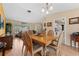 Inviting dining area with wooden table and access to the living room and kitchen at 945 Winding Oaks Dr, Palm Harbor, FL 34683