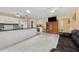 Spacious kitchen opens to the living area, featuring white cabinets, tiled floors, and a center island at 945 Winding Oaks Dr, Palm Harbor, FL 34683