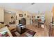 Open concept living room and dining room featuring neutral walls and wood laminate flooring at 945 Winding Oaks Dr, Palm Harbor, FL 34683