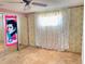 A bedroom with floral wallpaper and a mirrored closet at 9510 Mark Twain Ln, Port Richey, FL 34668