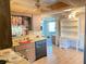 Kitchen featuring tile floors and vintage cabinets at 9510 Mark Twain Ln, Port Richey, FL 34668
