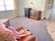 Cozy living room with carpet and a comfortable chair at 9510 Mark Twain Ln, Port Richey, FL 34668