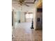 Open living room featuring tile floors and views of an additional Gathering room at 9510 Mark Twain Ln, Port Richey, FL 34668